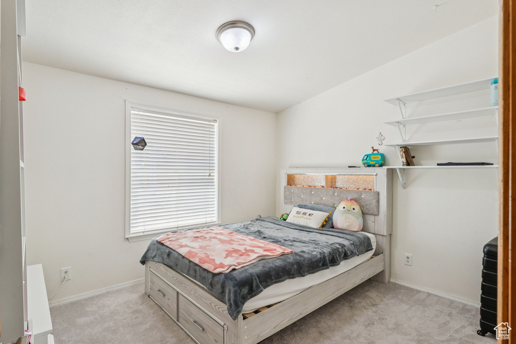 Bedroom with carpet and baseboards