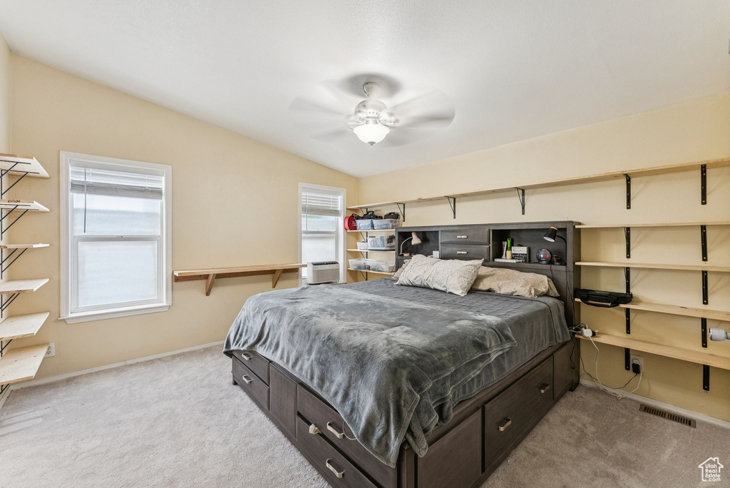 Bedroom featuring carpet floors, baseboards, and a ceiling fan