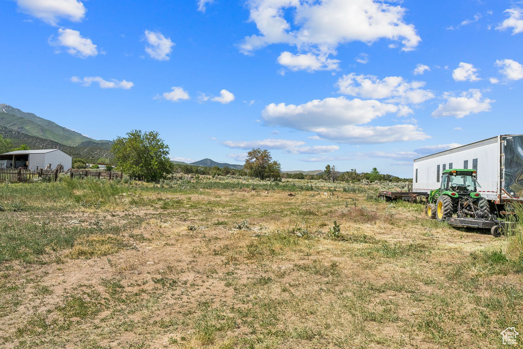 View of yard with a mountain view and a view of countryside