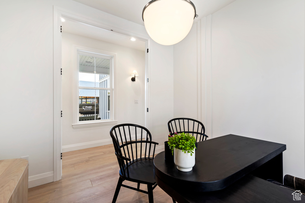 Dining room with light wood-style floors and baseboards