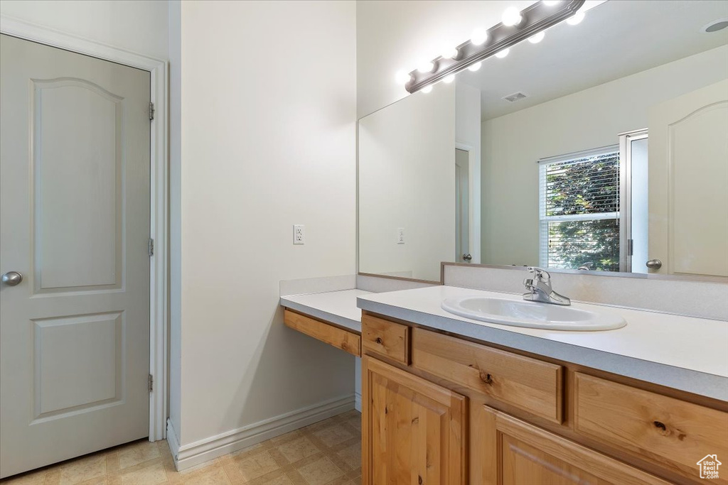Bathroom with vanity and tile patterned floors