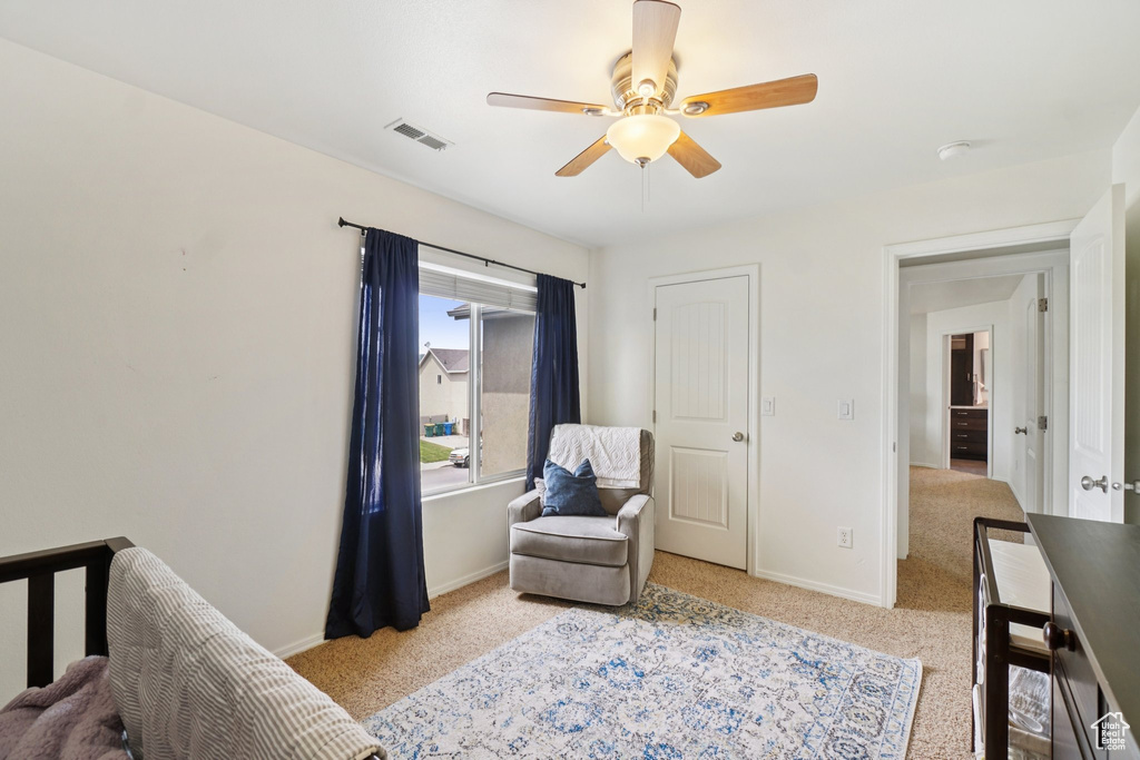 Bedroom with carpet floors, baseboards, and ceiling fan
