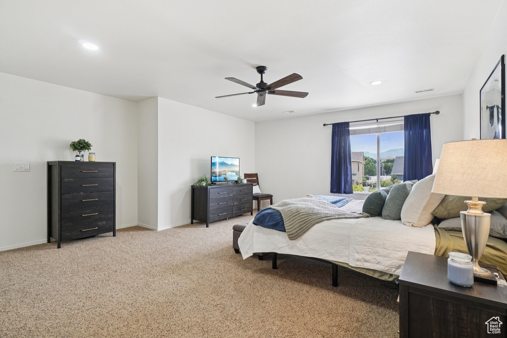 Bedroom with light carpet, recessed lighting, a ceiling fan, and baseboards