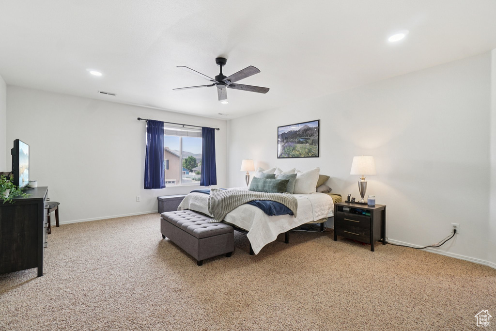 Bedroom featuring light carpet, baseboards, recessed lighting, and ceiling fan