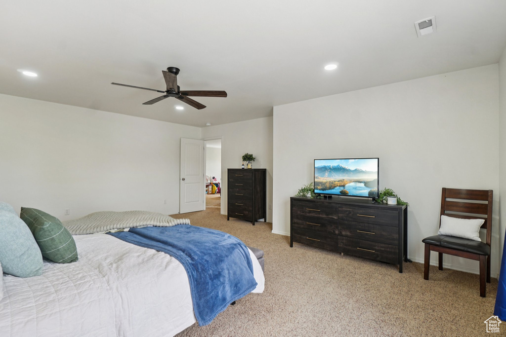 Carpeted bedroom with recessed lighting and ceiling fan