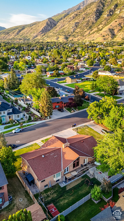 Aerial perspective of suburban area with a mountainous background