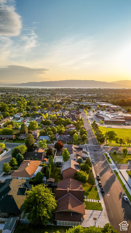 Aerial view of residential area featuring a mountainous background