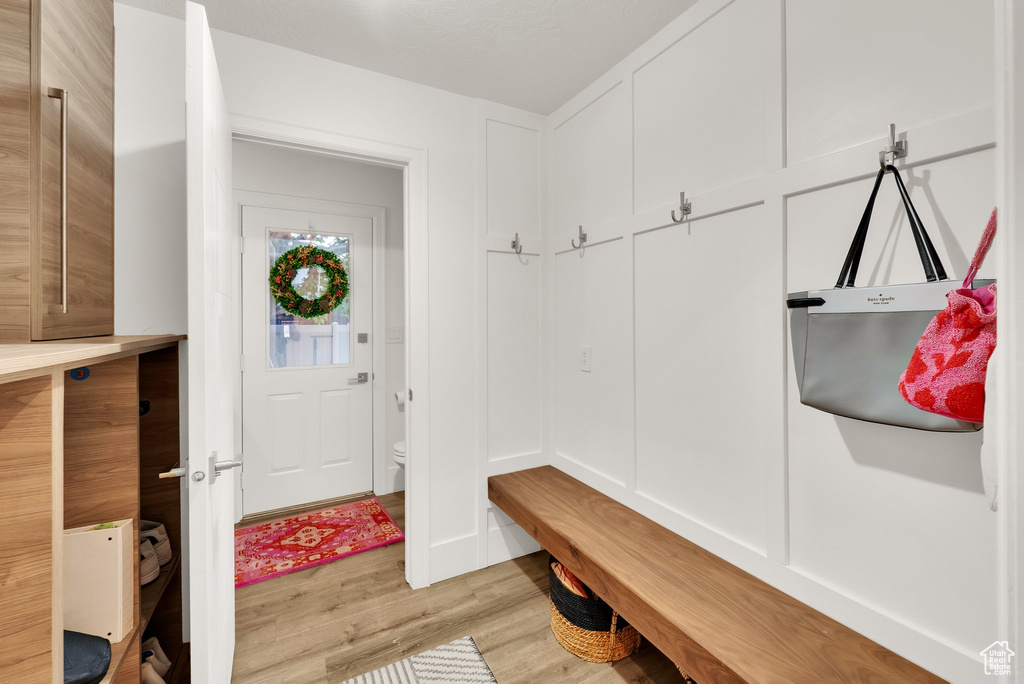 Mudroom with light wood-style floors