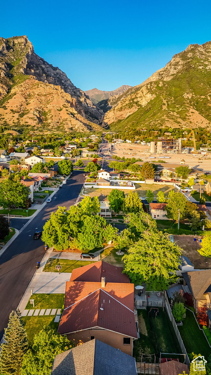 Aerial perspective of suburban area featuring a mountainous background