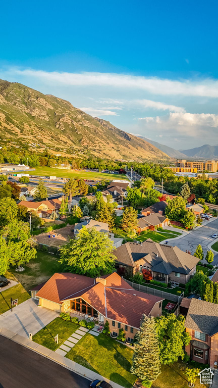 Aerial view of residential area featuring a mountainous background