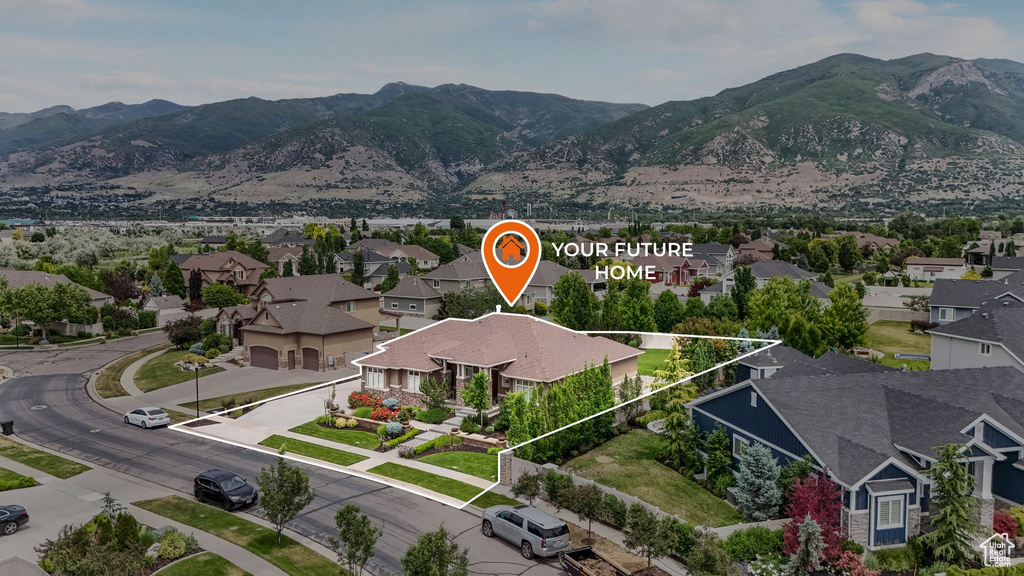 Aerial perspective of suburban area featuring a mountain backdrop and property boundaries highlighted