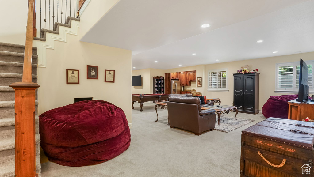 Living room featuring light colored carpet, stairway, billiards table, and recessed lighting