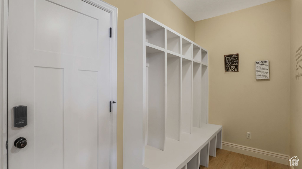 Mudroom featuring baseboards and light wood finished floors