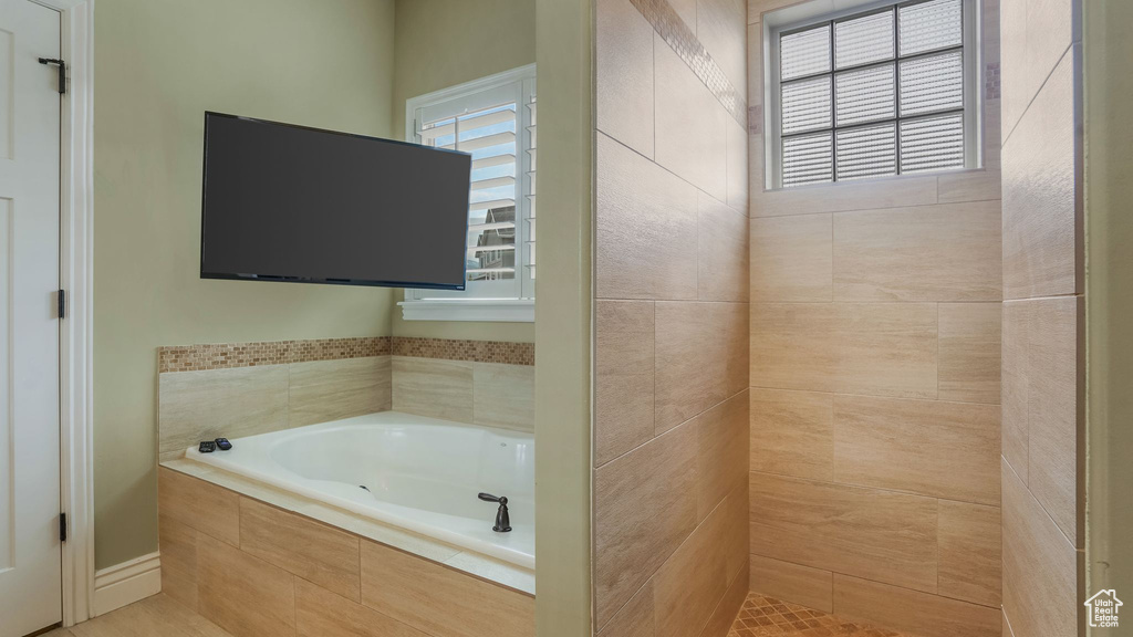 Full bath featuring a garden tub