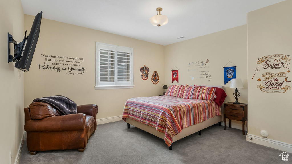 Bedroom with carpet and baseboards