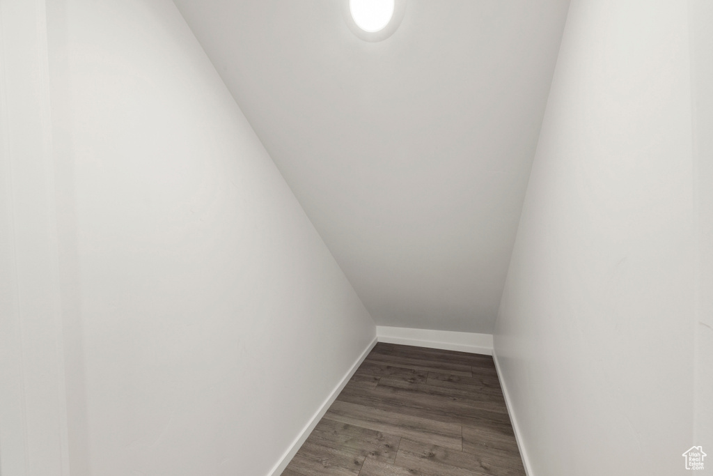 Stairs featuring baseboards and wood finished floors