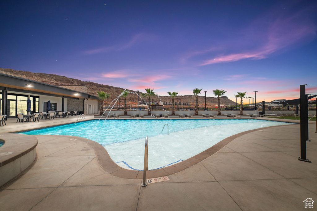 Community pool with a patio area