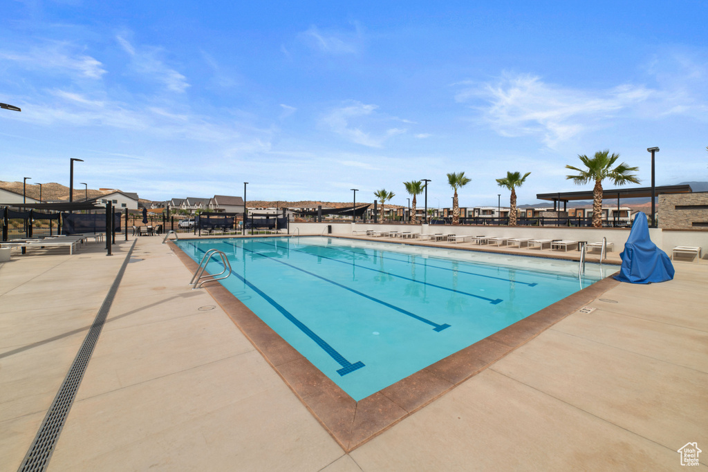 Community pool featuring a patio