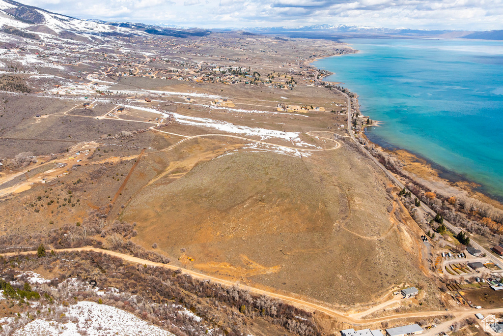 View of property location featuring a water and mountain view