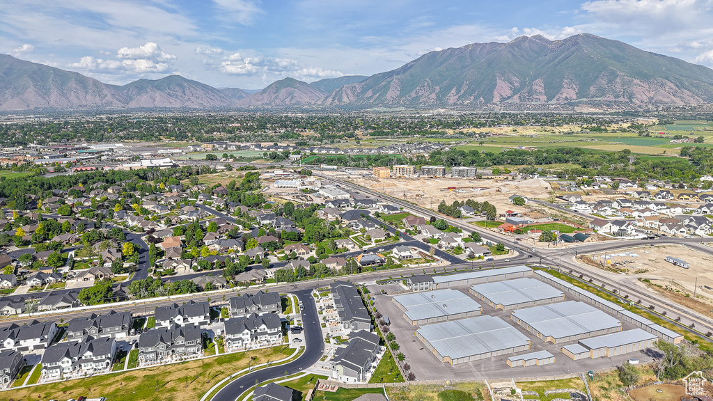 Aerial view of property\'s location featuring a mountain backdrop