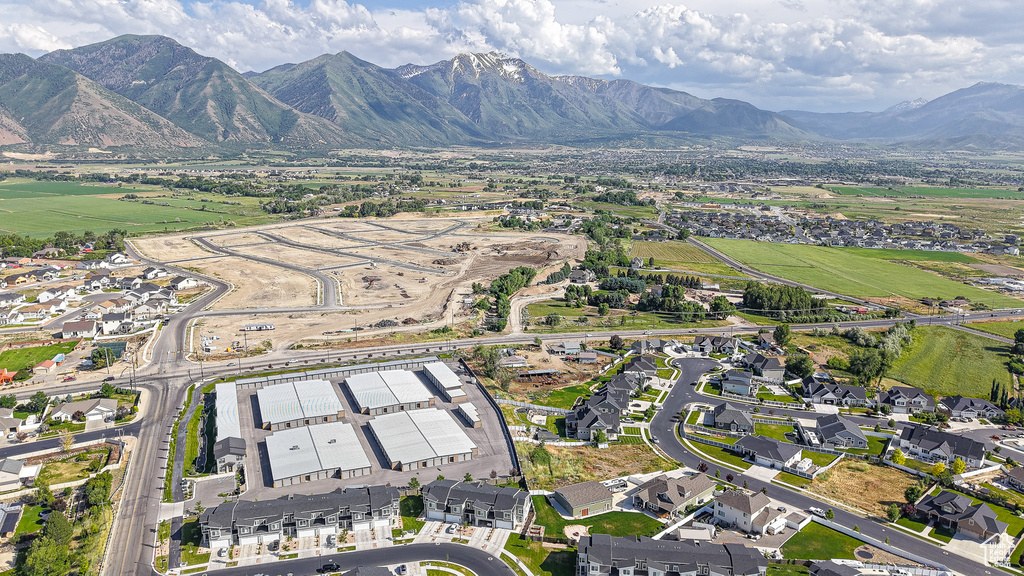 Aerial view of property\'s location with a mountainous background