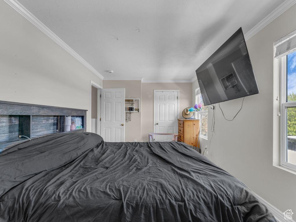 Bedroom featuring crown molding