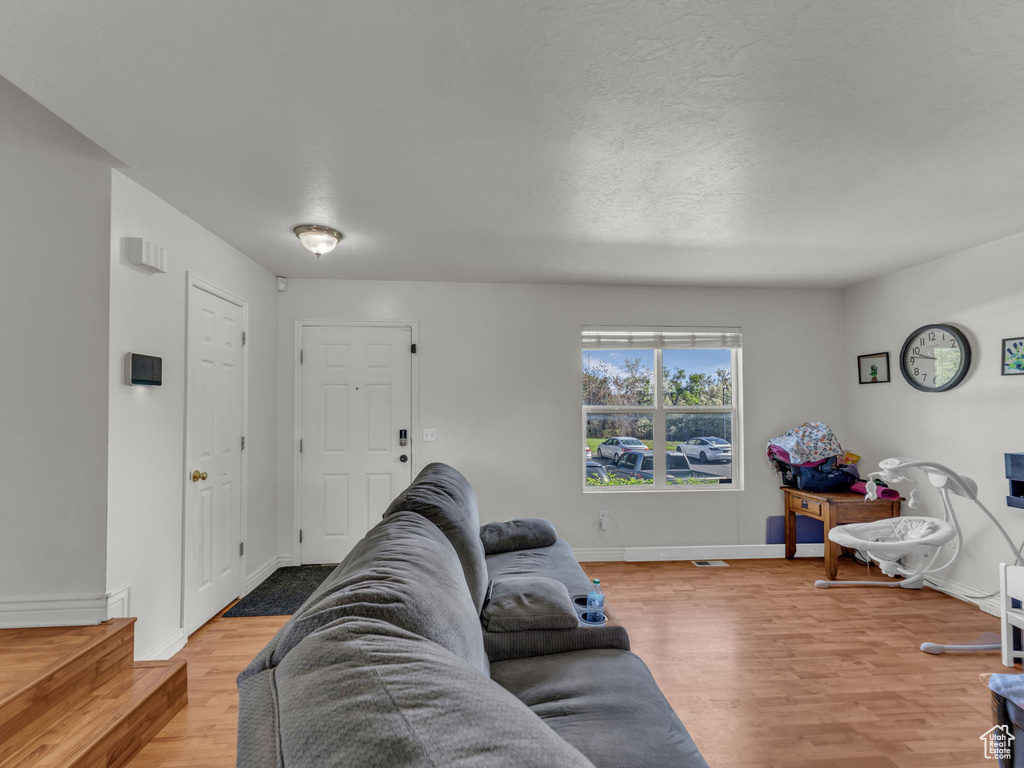 Living room featuring wood finished floors and baseboards