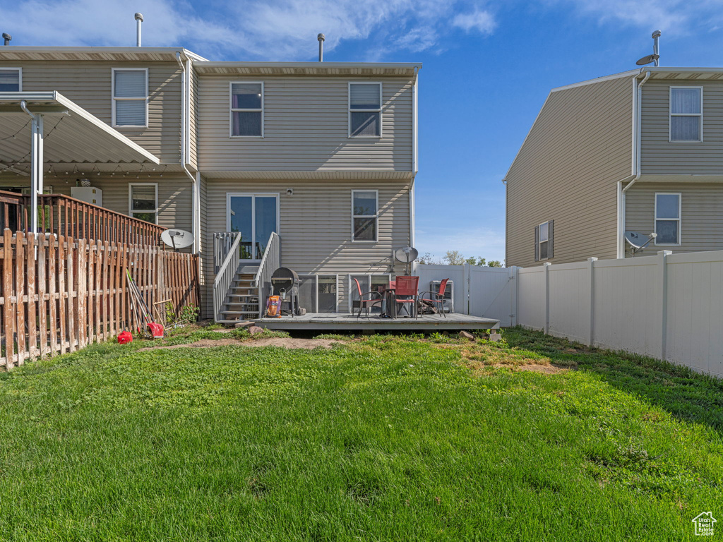 Back of house featuring a deck
