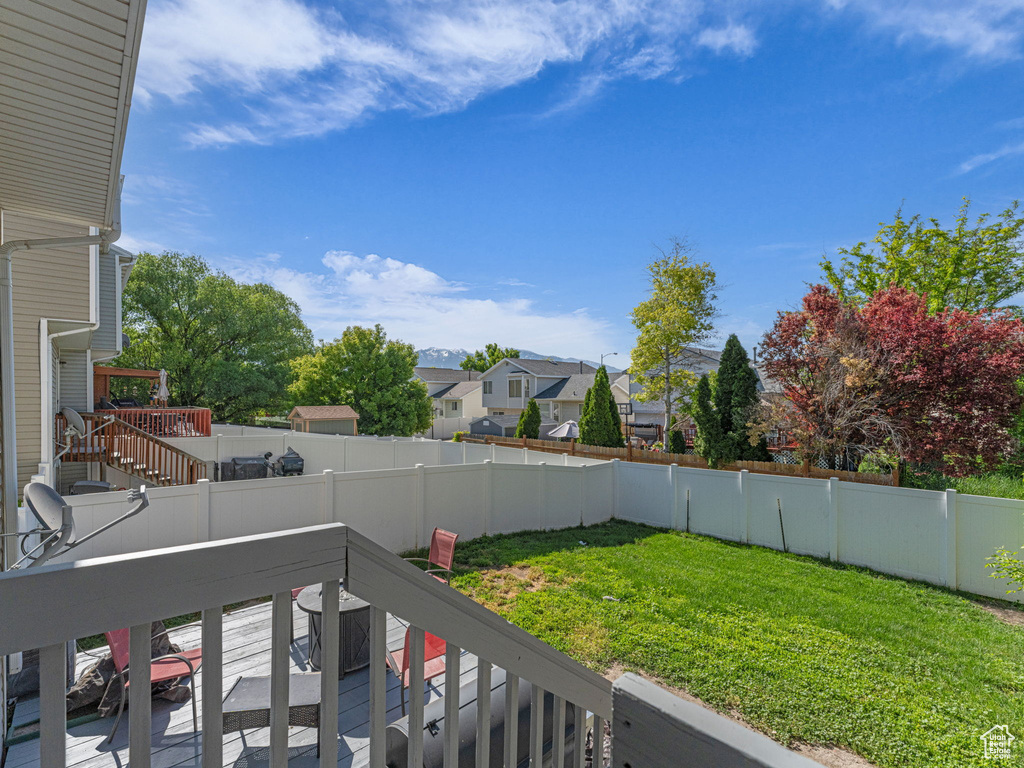 View of yard featuring a deck, a residential view, and stairway