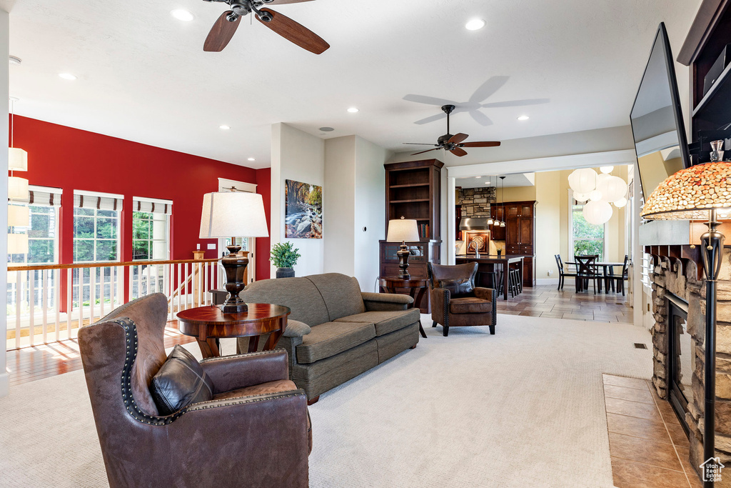 Living room featuring ceiling fan, healthy amount of natural light, and recessed lighting
