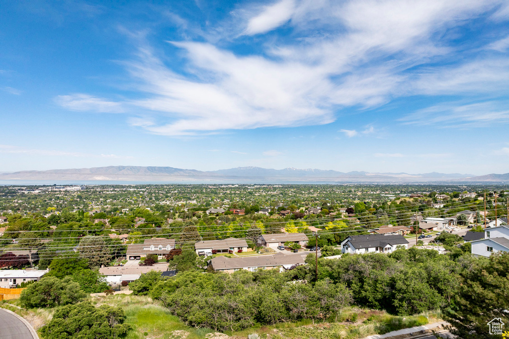 Aerial view of residential area featuring mountains
