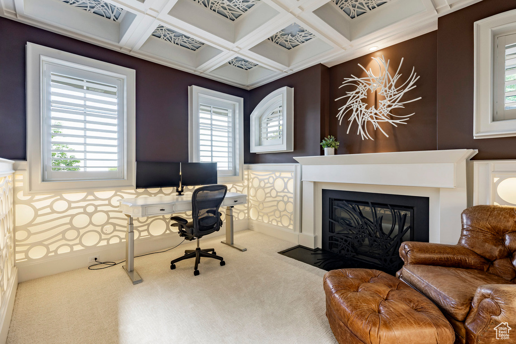 Office space with carpet flooring, a fireplace with flush hearth, coffered ceiling, healthy amount of natural light, and beamed ceiling