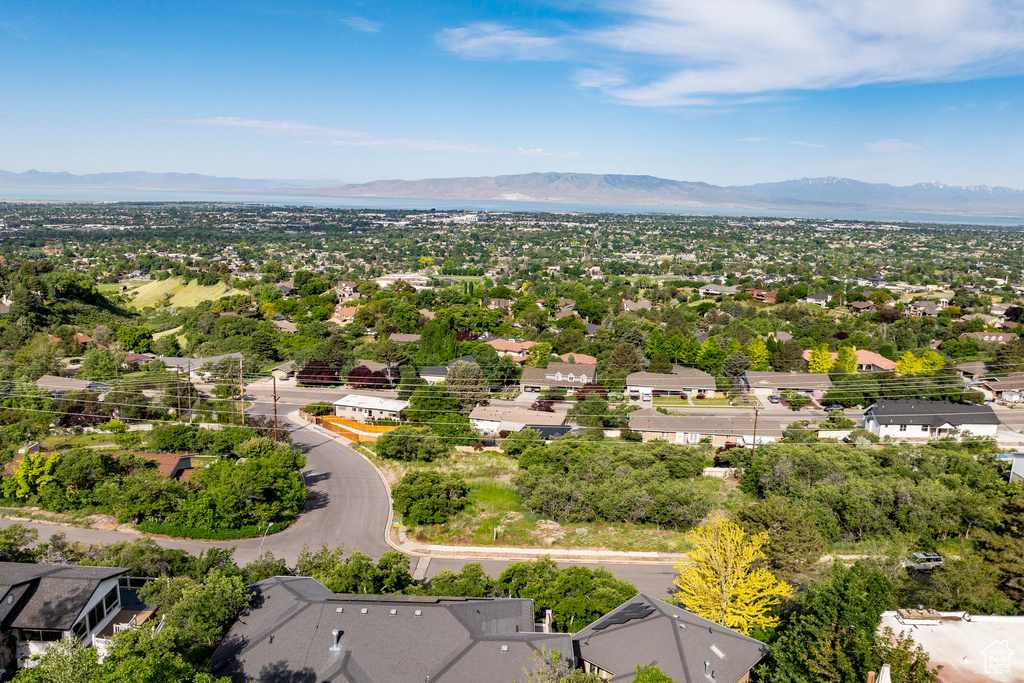 Aerial perspective of suburban area featuring a mountainous background