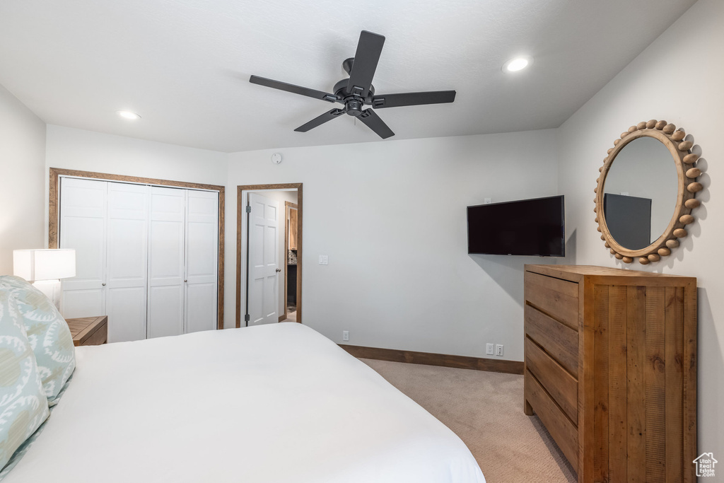 Bedroom with light carpet, baseboards, a closet, recessed lighting, and ceiling fan