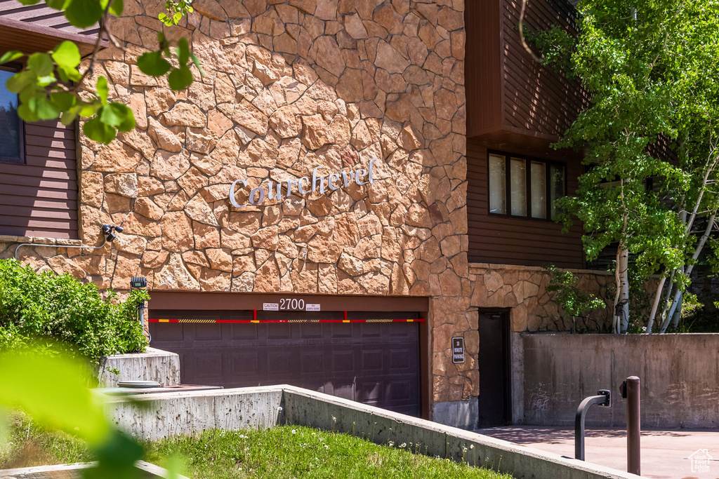 View of building exterior with a garage