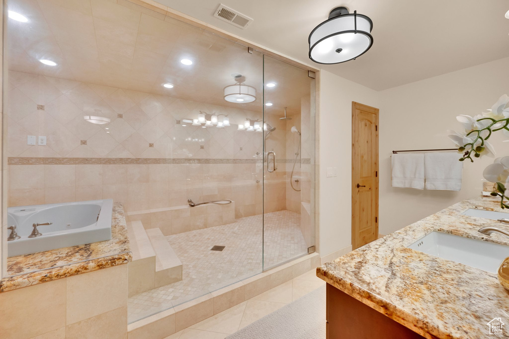 Full bath with a shower stall, tile patterned floors, a whirlpool tub, double vanity, and recessed lighting