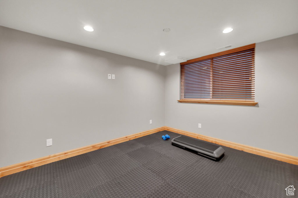 Workout room with baseboards and recessed lighting