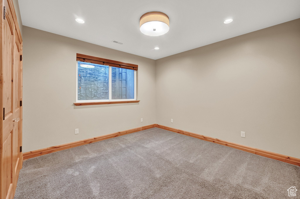 Spare room with baseboards, carpet flooring, and recessed lighting
