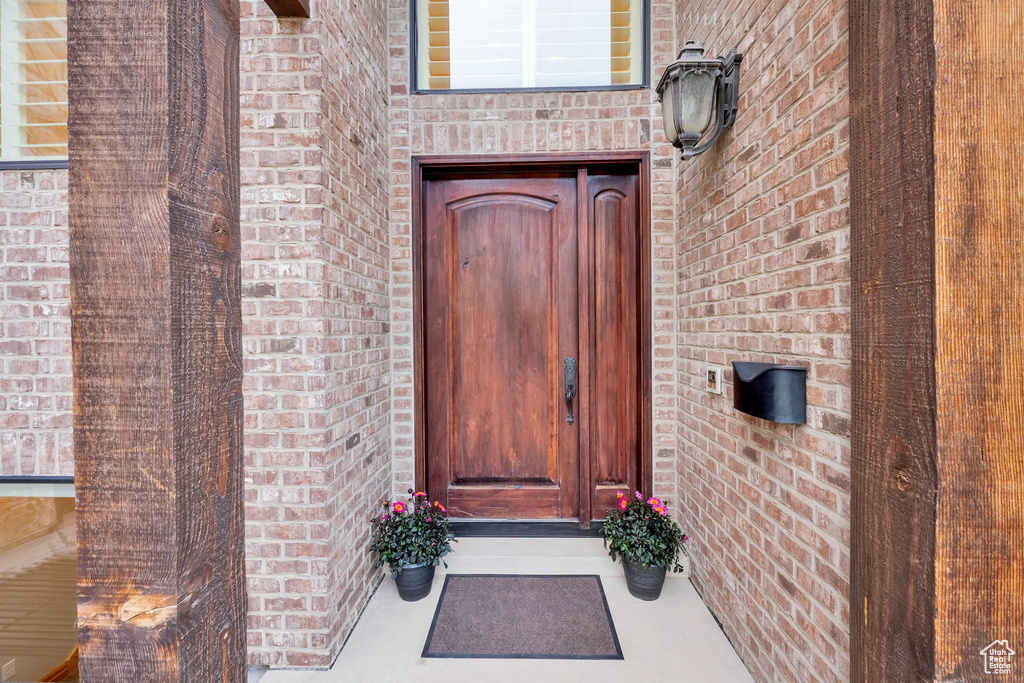 Property entrance with brick siding