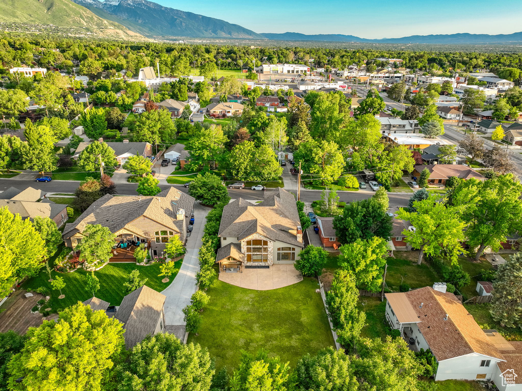 Aerial perspective of suburban area featuring a mountainous background