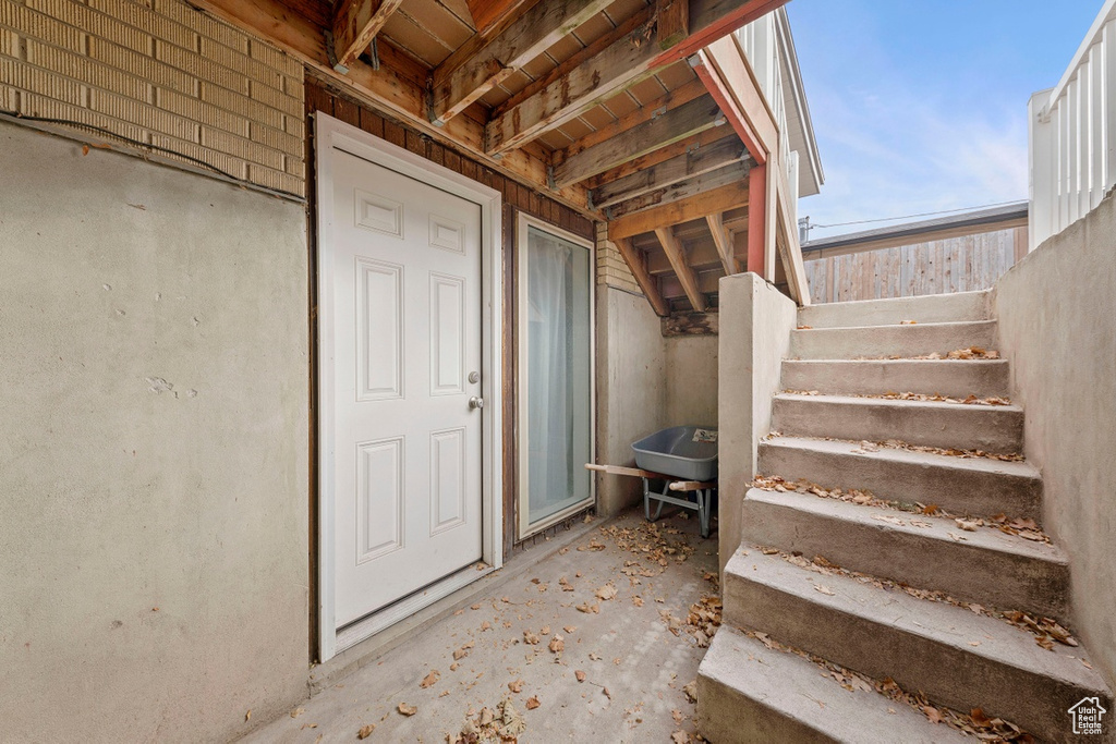 Entrance to property featuring stucco siding
