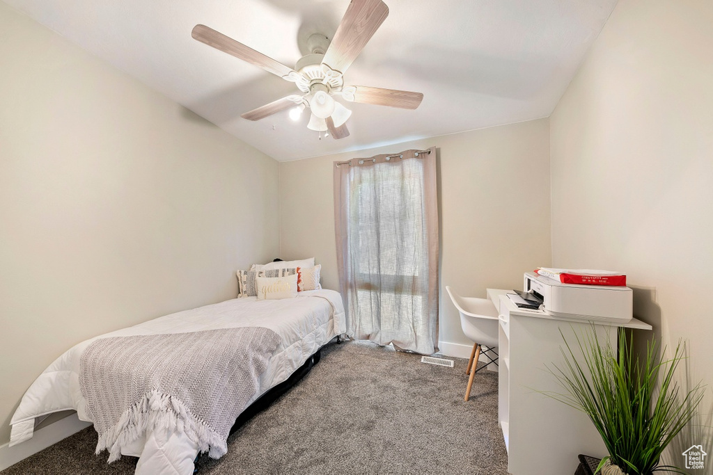Bedroom with carpet and a ceiling fan