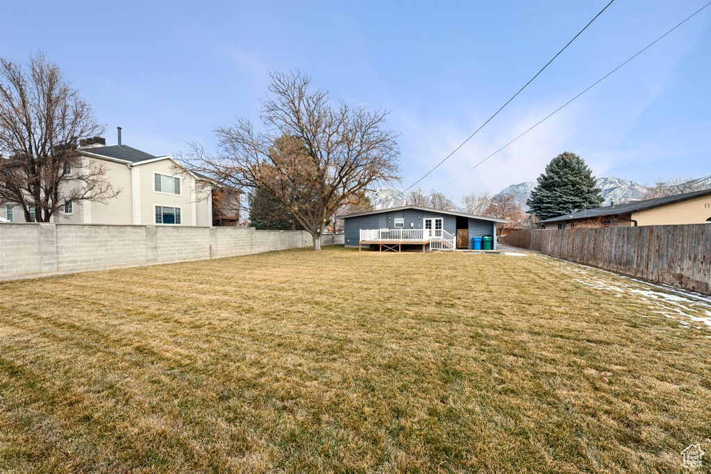 View of yard with a deck