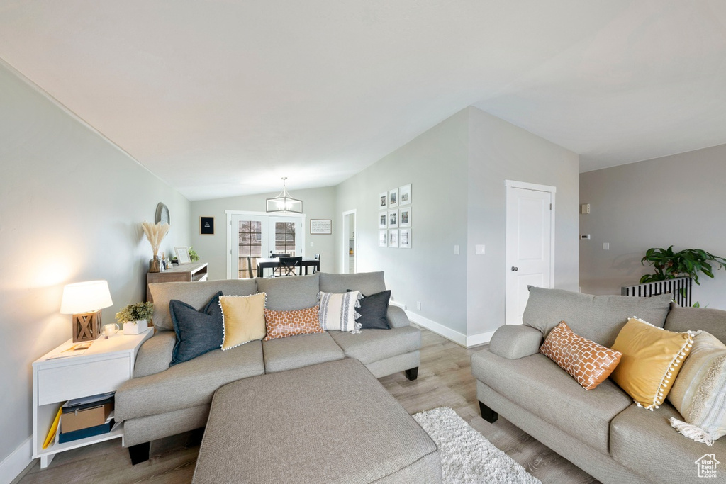 Living room with light wood finished floors and baseboards