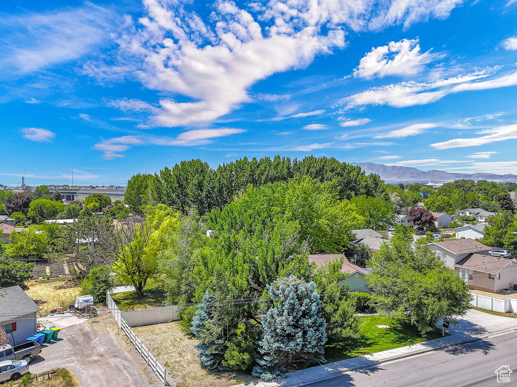 Aerial view of residential area featuring a mountainous background