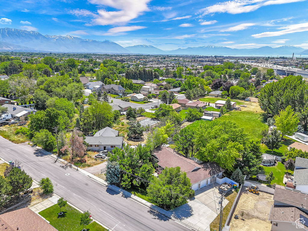 Aerial perspective of suburban area with a mountainous background