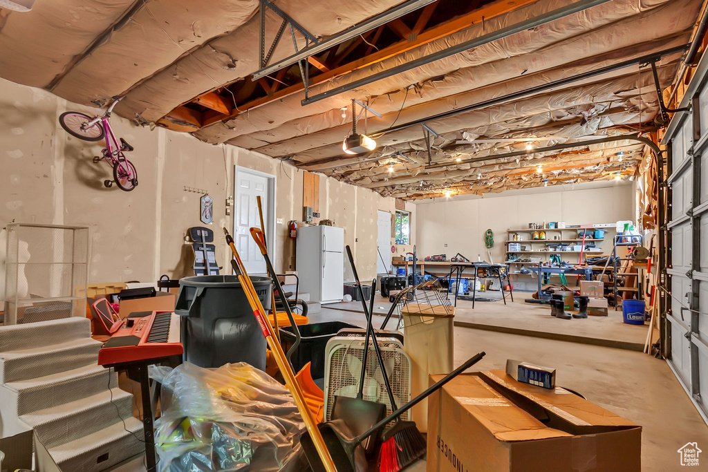 Below grade area with freestanding refrigerator