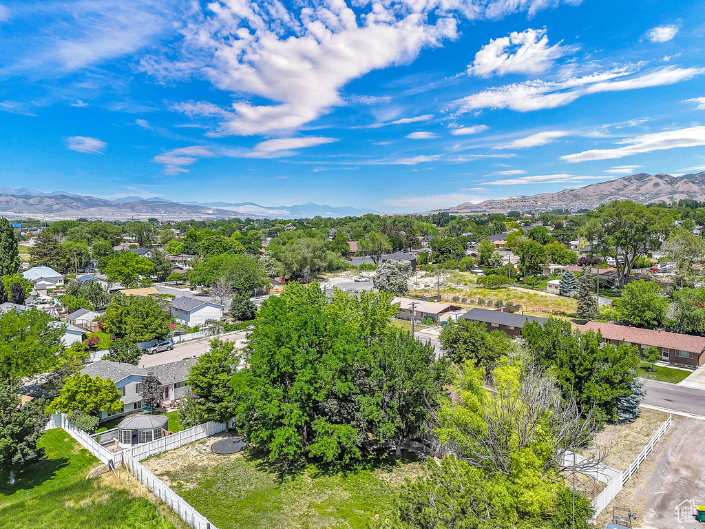 Aerial perspective of suburban area featuring a mountain backdrop