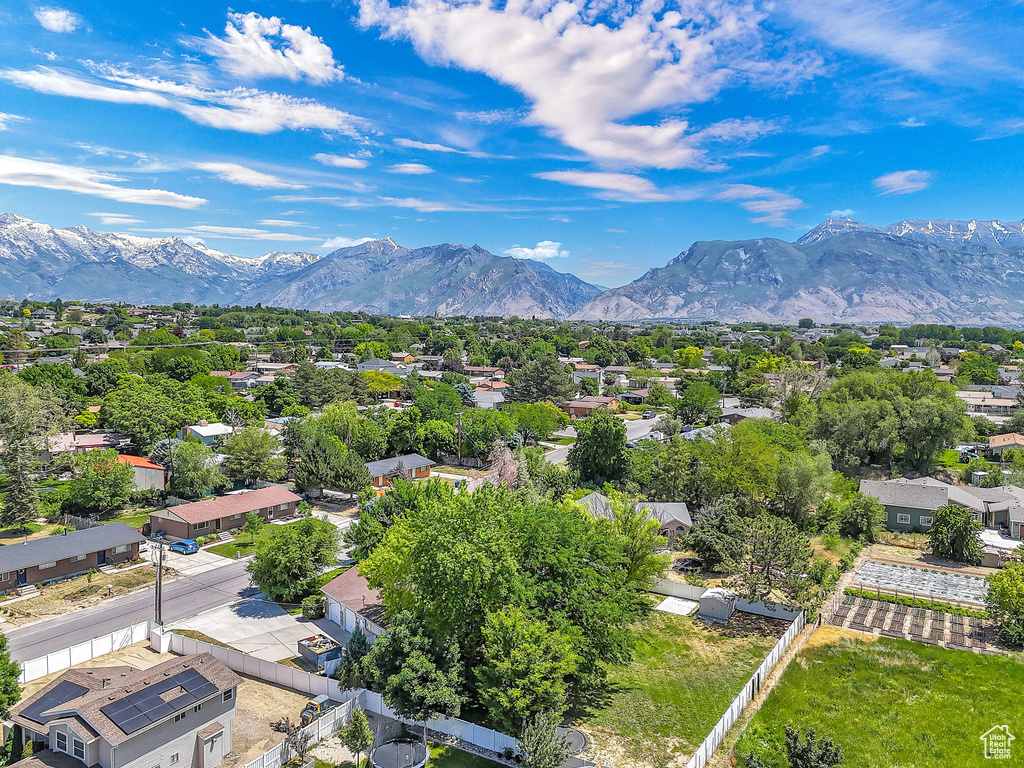 Aerial perspective of suburban area featuring a mountainous background