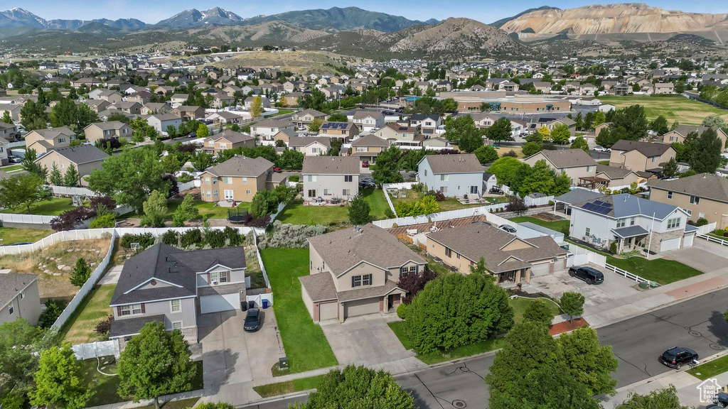 View of property location with mountains and nearby suburban area